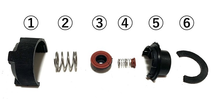 Internal components of a cut-open Ferrari radiator cap, part number 145030